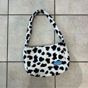 Black and white cow print purse